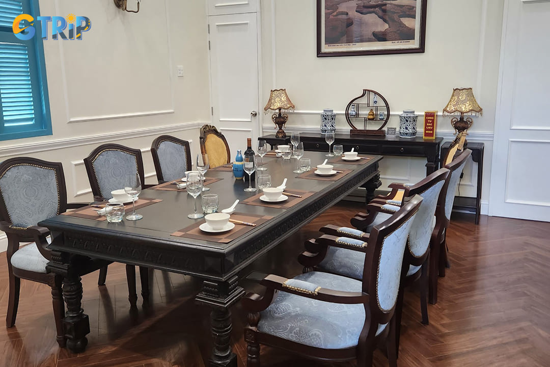 Imported porcelain plates, silverware, and glassware are still on display
