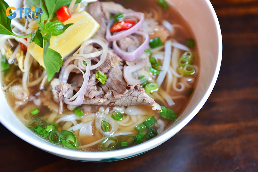 In the early hours, warm bowls of pho bo (beef noodle soup) provide quick and satisfying options