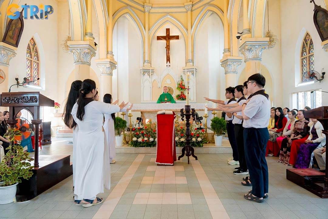Inside, the cathedral offers a serene Gothic interior with soaring arches, a grand altar, and colorful stained-glass windows that bathe the space in soft, reverent light
