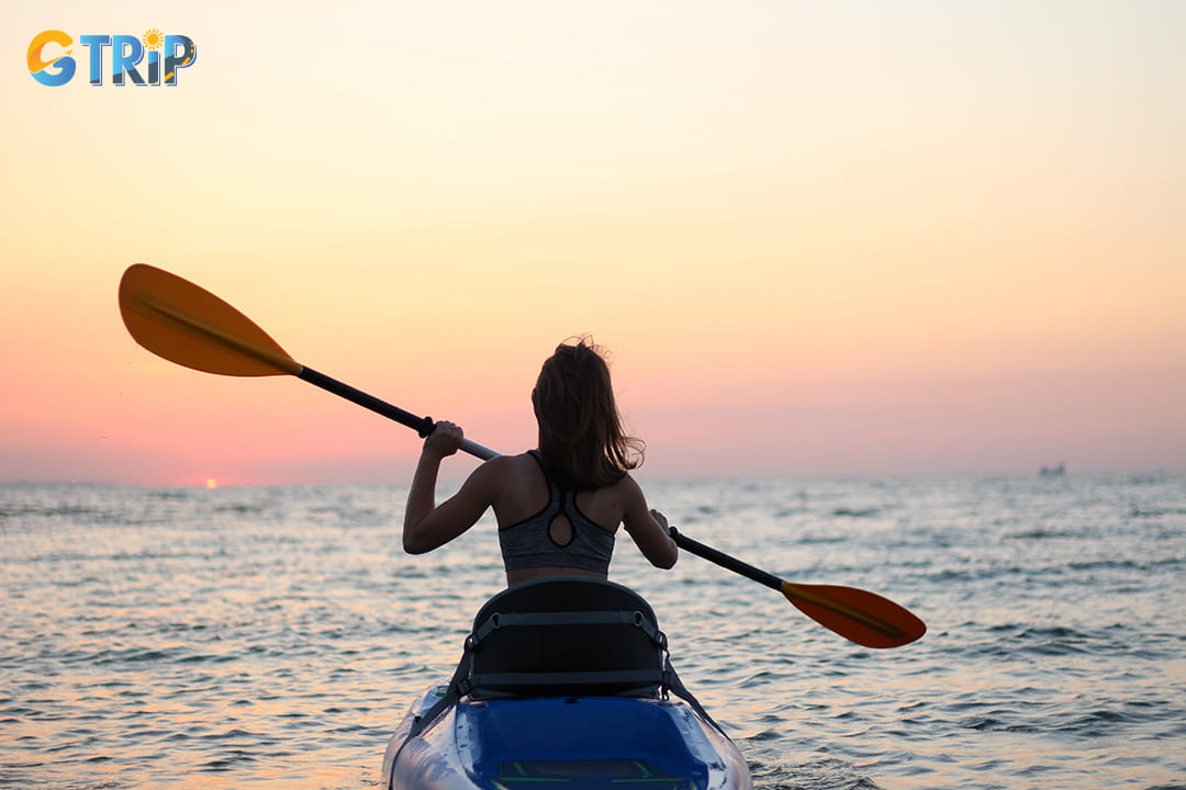 Kayaking along the serene waters of Quan Lan Beach is an adventure that offers a unique perspective