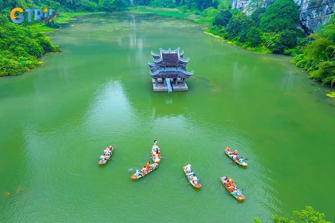 Tourists float by boat on the river