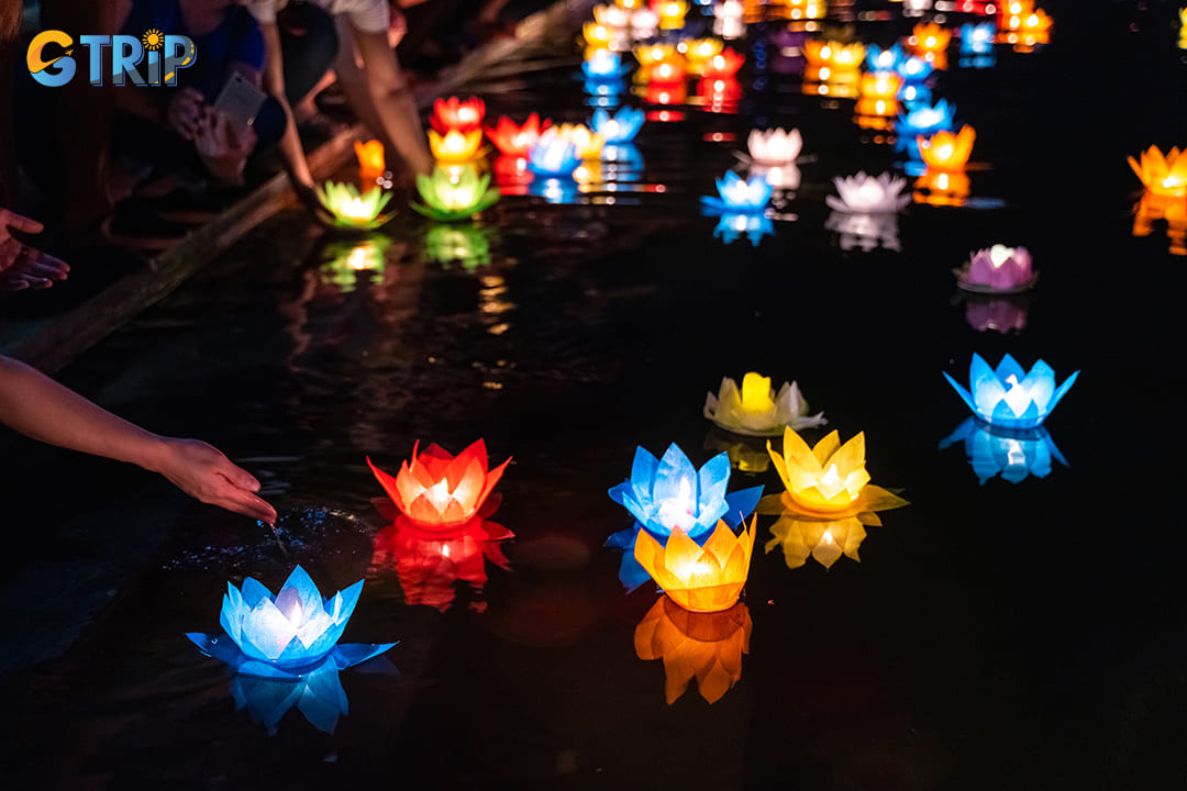 Lantern ceremonies, where colorful paper lanterns are released onto lakes and ponds at dusk, create a magical atmosphere even amid monsoon rains