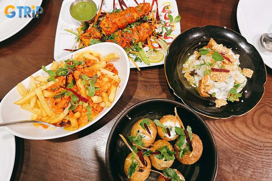 MAAZI is a stylish Indian restaurant in the city center serving rich North Indian curries, fresh naan, and late-night drinks