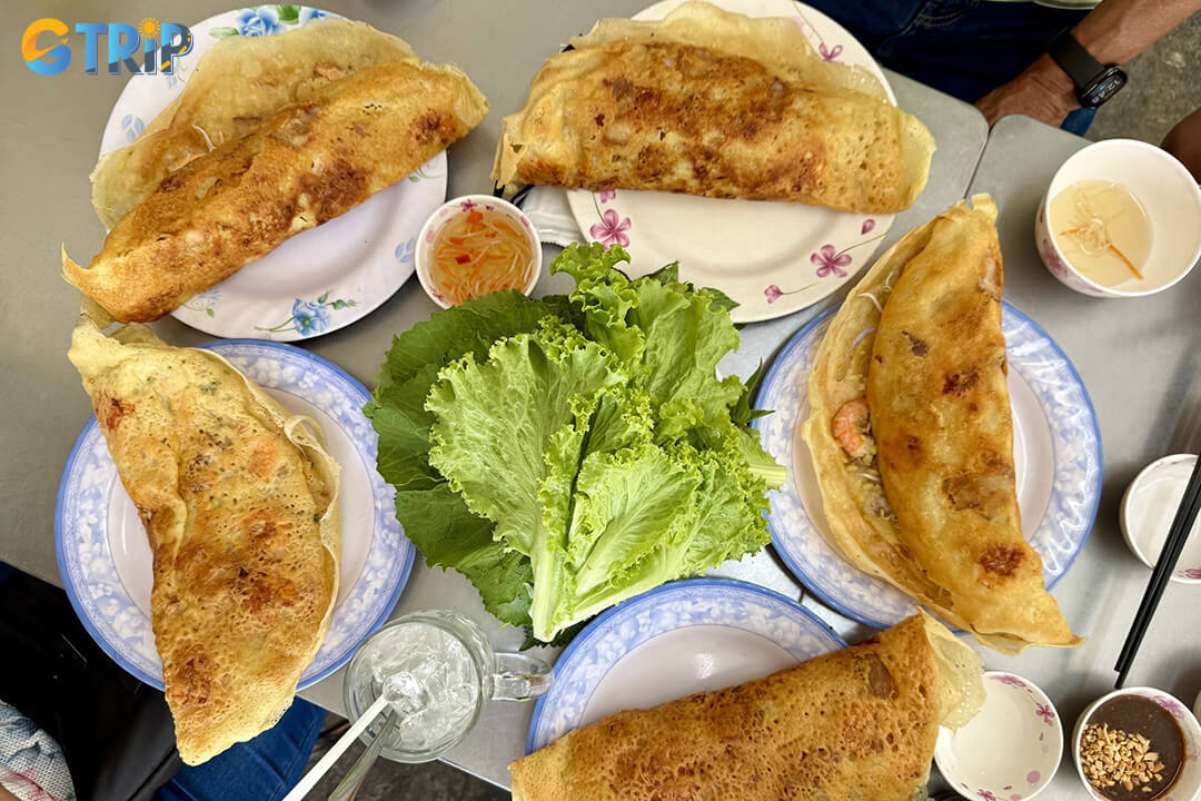 Michelin-recommended Banh Xeo 46A serves iconic Southern-style pancakes with a crispy coconut-turmeric shell and savory shrimp and pork filling