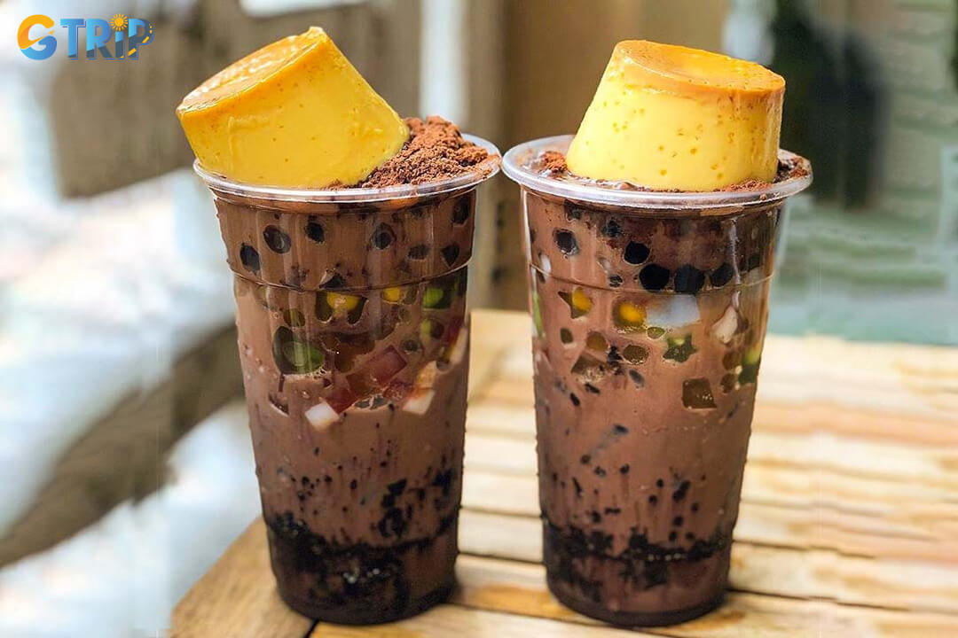 Milo dam is a popular Vietnamese dessert of shaved ice mixed with Milo powder, condensed milk, and toppings for a sweet, chocolatey, and crunchy treat