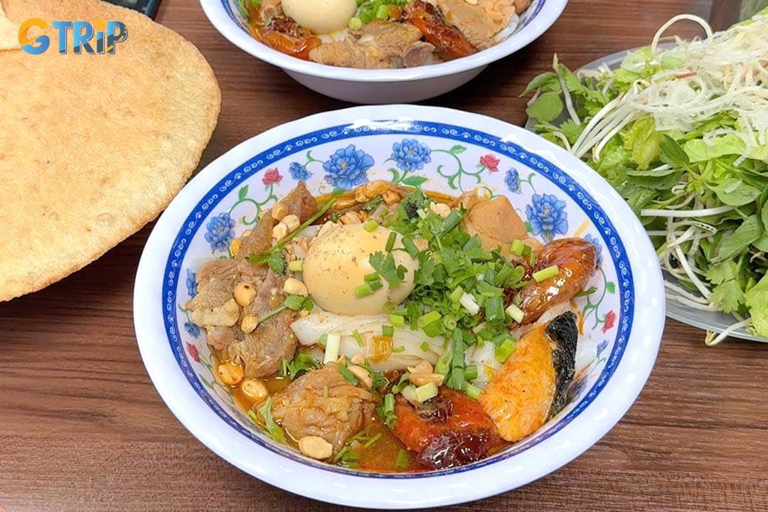 My Quang Lan Phuong is a humble local favorite known for its savory broth, fresh chewy noodles, generous toppings, and no-frills street food charm