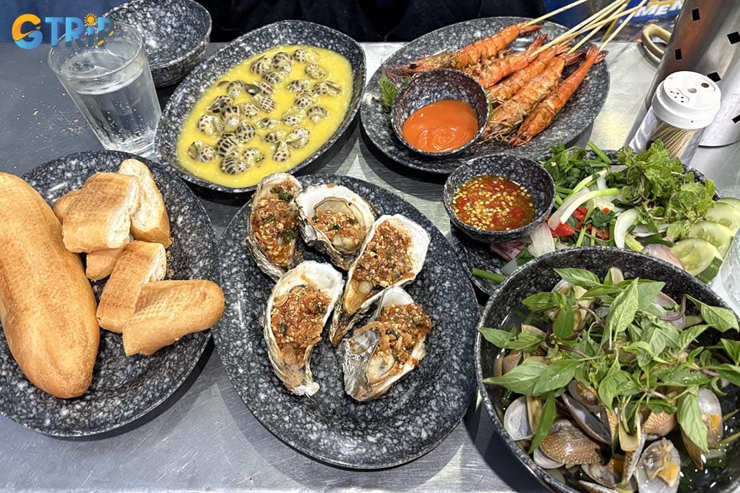 Nam Danh Seafood is a hidden local favorite tucked in a small alley, famous for affordable seafood and strong authentic flavors