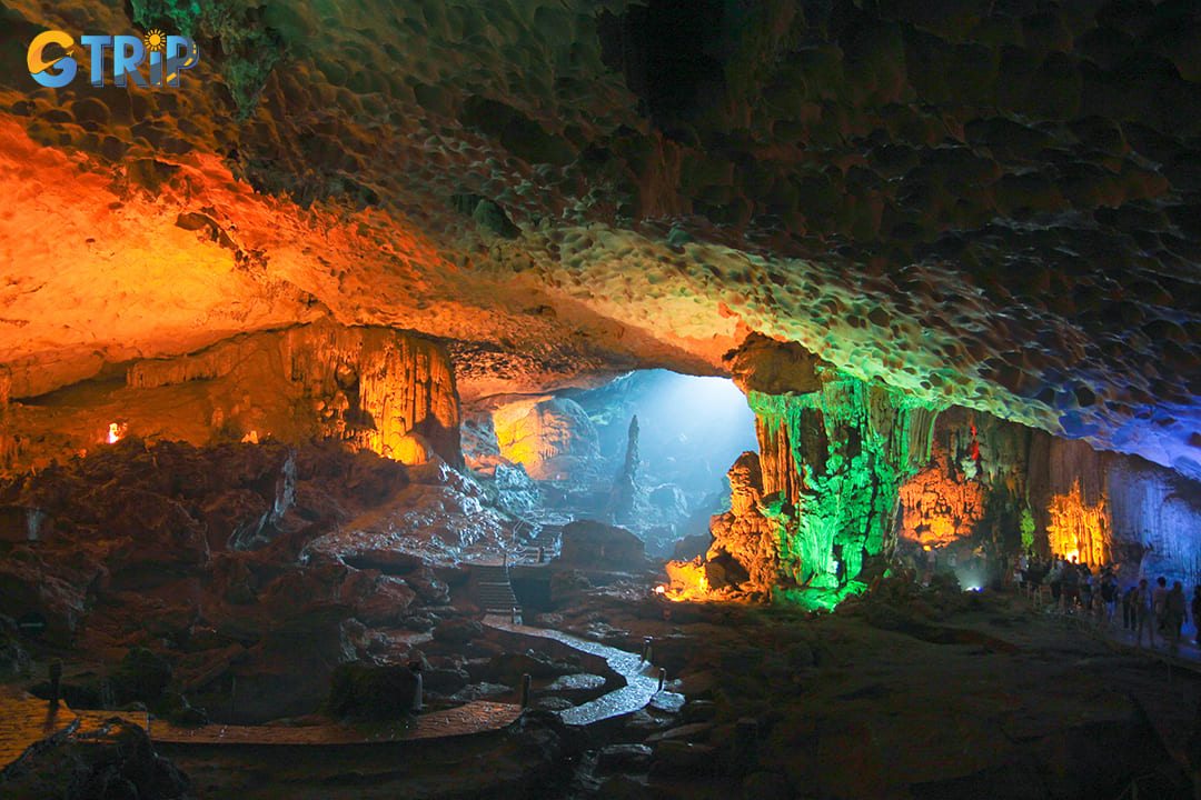 Natural light enhances the formations, casting colorful reflections throughout the Me Cung Cave