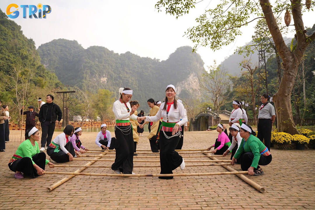 Near the stilt houses, a lively courtyard invites visitors to join traditional Vietnamese folk games like bamboo pole dancing and con throwing for a fun cultural experience