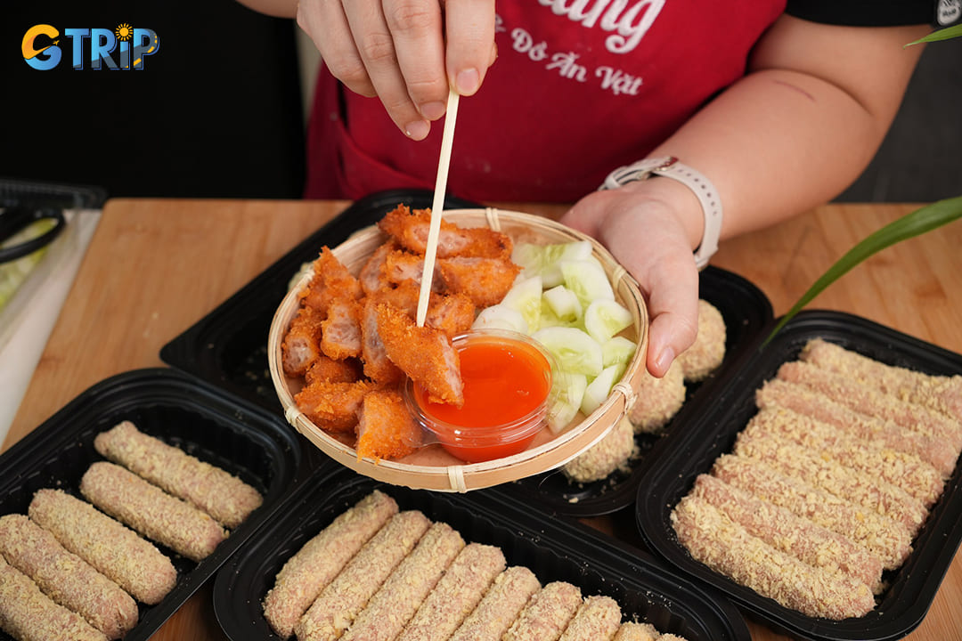 Nem chua ran (fried fermented pork rolls) represents one of Hanoi's most beloved street snacks, combining the tangy flavor of fermented pork with a crispy, golden exterior