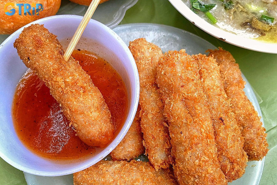 Nem chua ran is a crispy fried fermented pork snack with a tangy, savory bite, beloved as a bold and addictive Hanoi street food