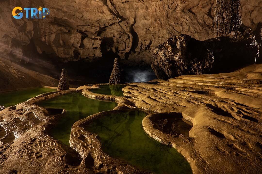 Nguom Ngao Cave offers stunning photography opportunities, with dramatic lighting enhancing its intricate limestone formations and reflective pools