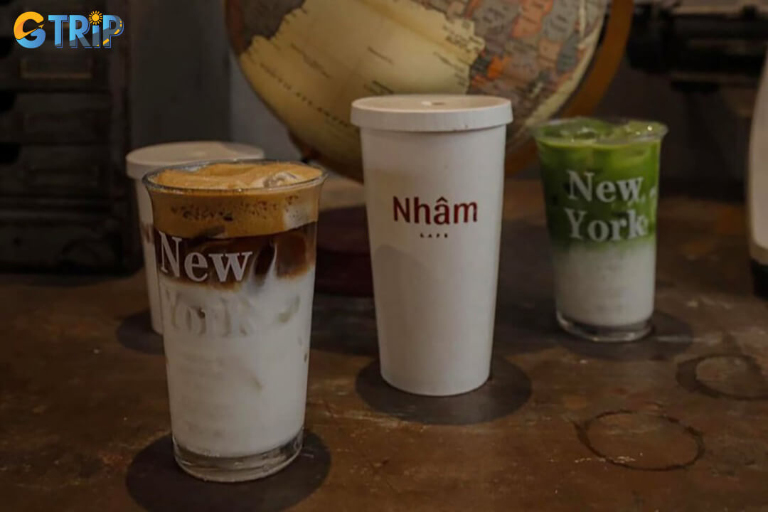 Nham Coffee offers unique drinks like salted coffee and iced matcha, alongside a diverse menu of coffees and teas, all served in a cozy, modern setting
