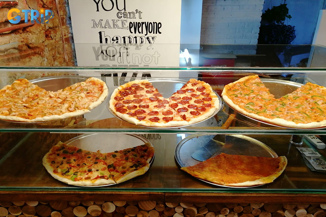 NYC Pizza Hanoi brings a slice of the Big Apple to Vietnam's capital, offering authentic New York-style pizza with thin, foldable crusts