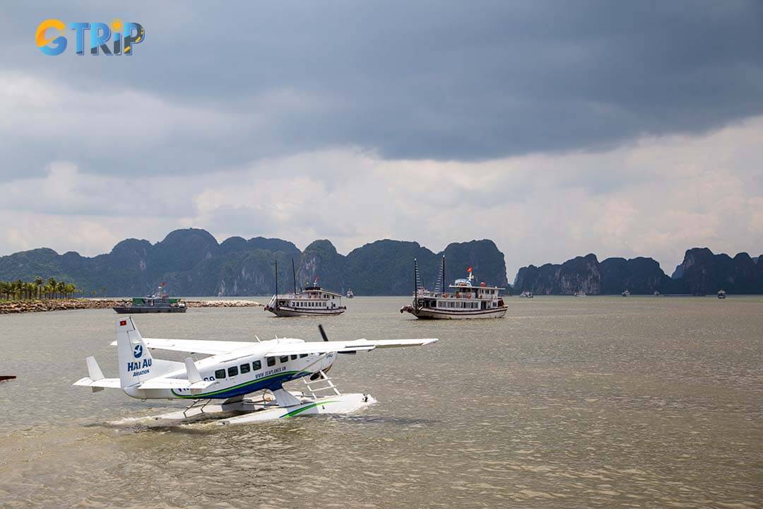 Soar above Ha Long Bay on a scenic seaplane flight, capturing breathtaking aerial views of its iconic limestone islands and emerald waters