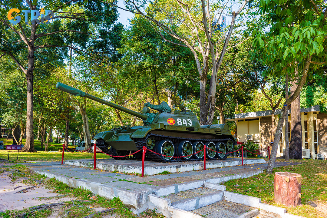 One of the notable outdoor exhibits is a display of military vehicles, including tanks and fighter jets