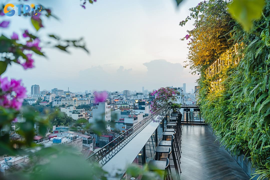 Overlooking the shimmering Hoan Kiem Lake from above, Hanoi's rooftop bars offer an enchanting evening with cocktails and a stunning sunset