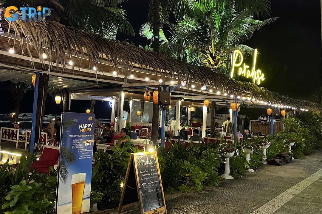 Paradise Beach Bar is a Bohemian beachfront hangout famous for fire dancing shows, tropical decor, and lively evening vibes