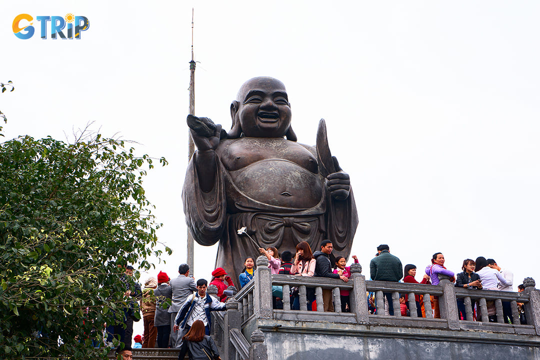 People under the statue in Bai Dinh Pagoda’s festival