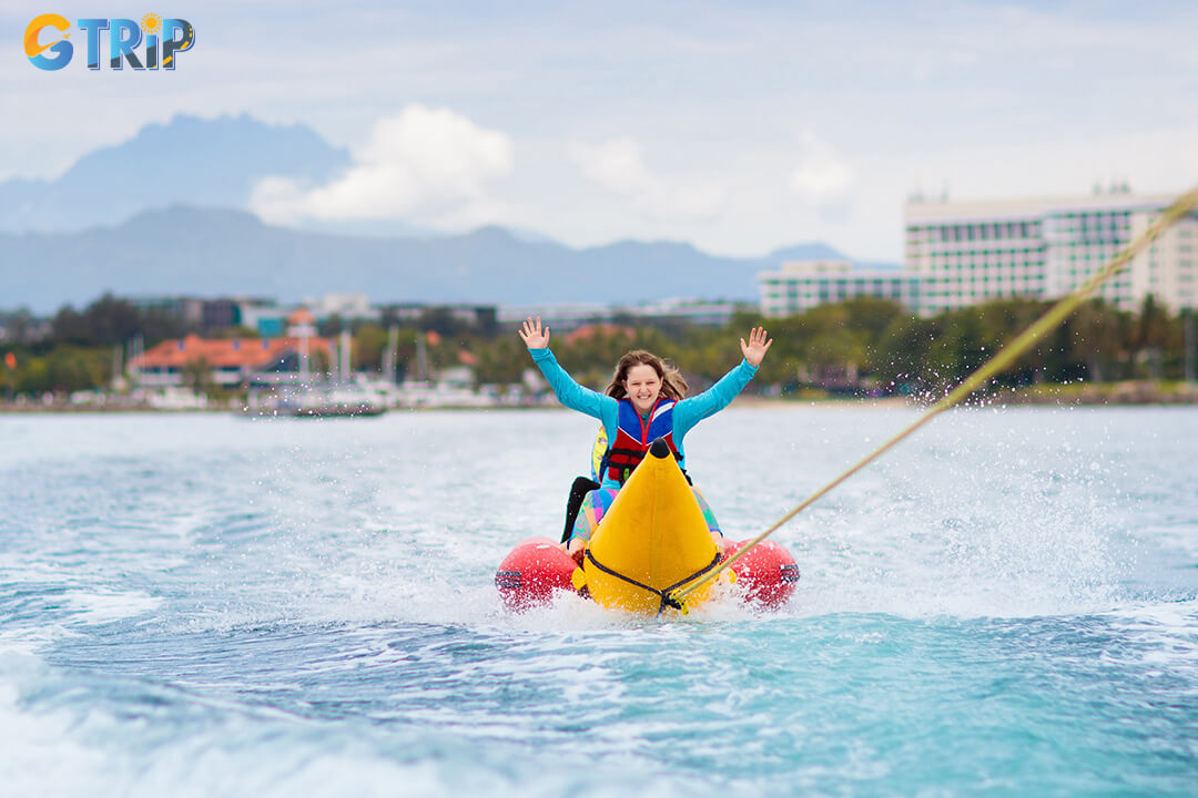 Pham Van Dong Beach offers plenty of excitement with water sports like parasailing, jet skiing, banana boat rides, and spacious sands for beach games
