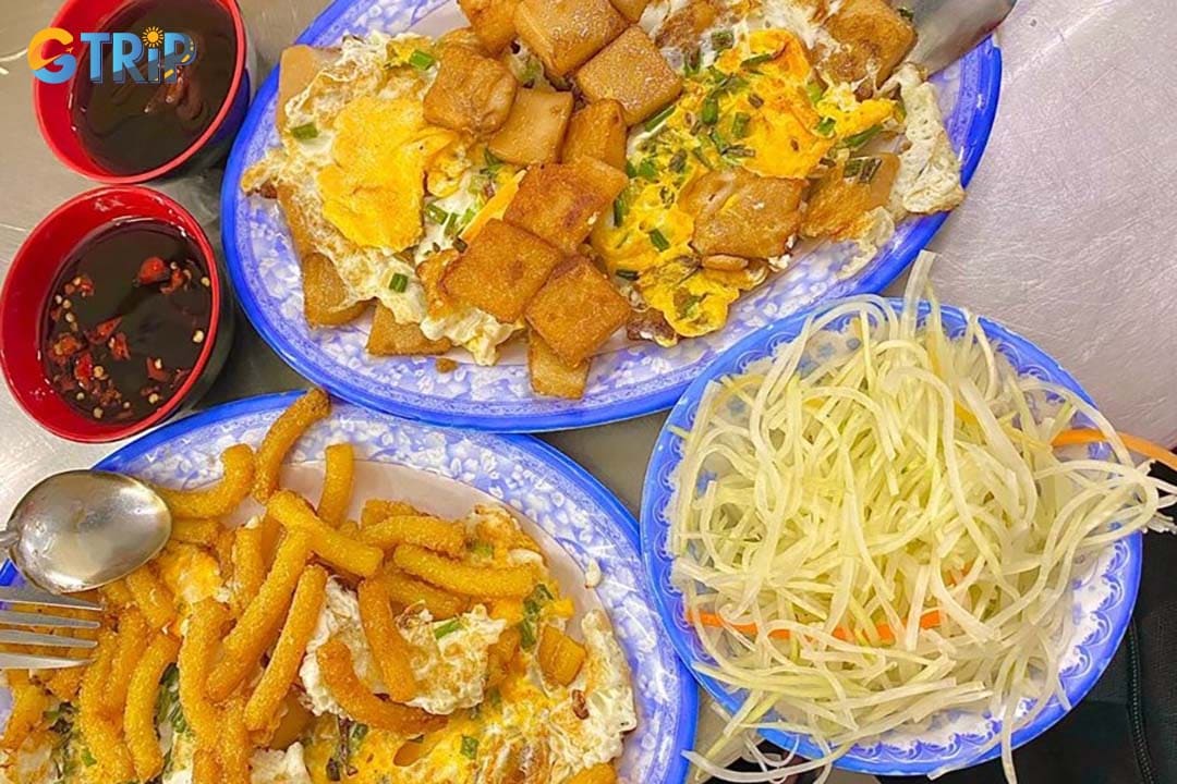 Phan Van Han Street is a favorite local food hub where students and workers gather to enjoy affordable, no-frills street food, especially the standout Bot Chien