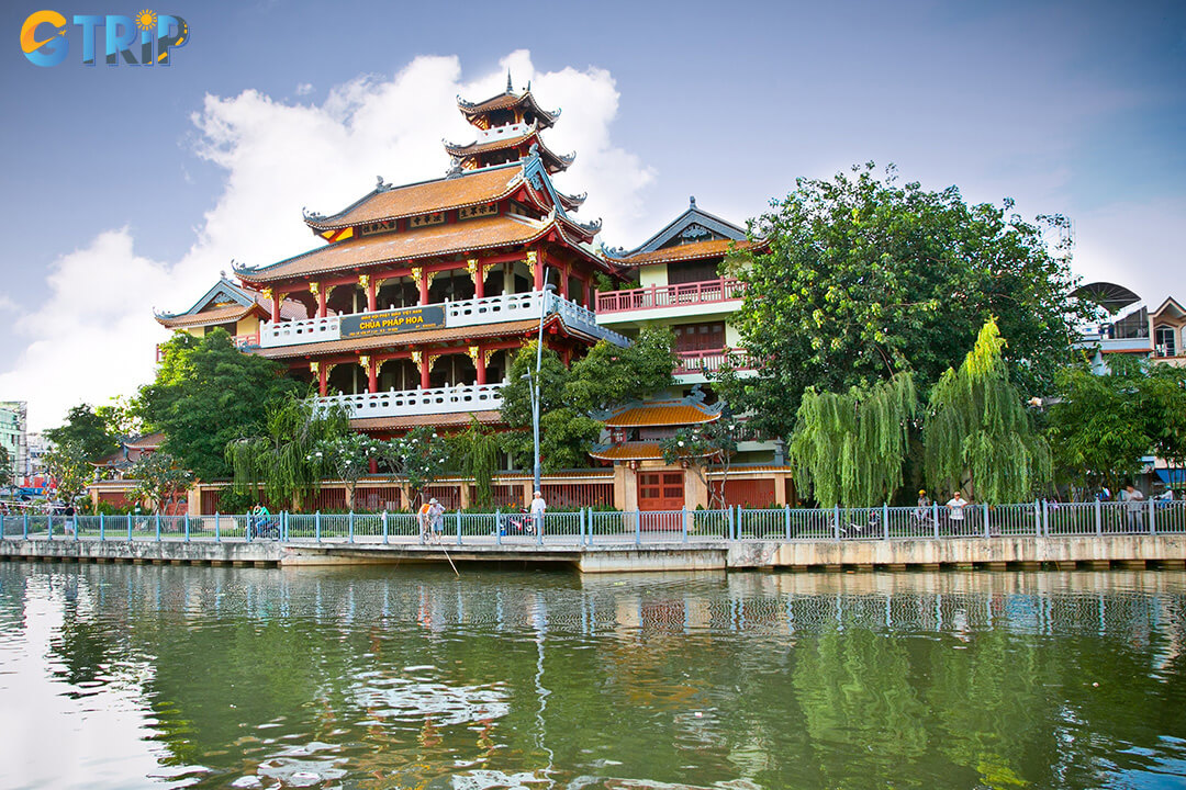 Phap Hoa Pagoda blends traditional Vietnamese architecture with serene gardens and golden tones, creating a peaceful spiritual haven by the Nhieu Loc Canal
