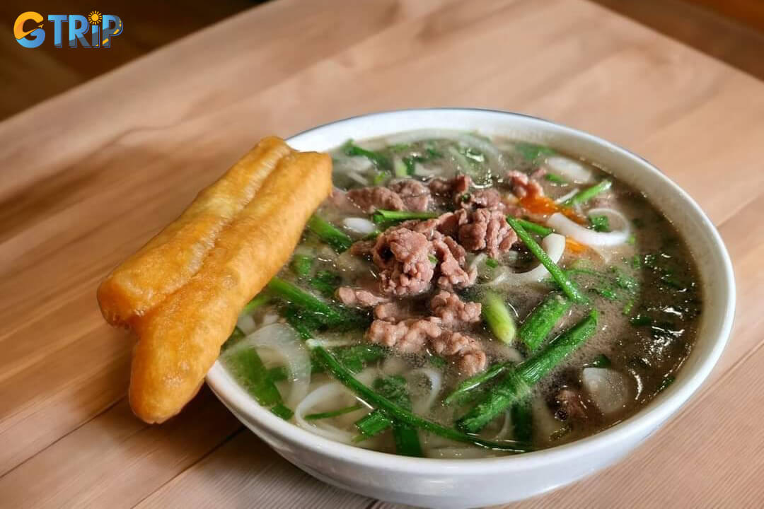 Pho Hoa Pasteur, a Saigon legend for over 50 years, serves authentic Northern-style pho with clear, fragrant broth and a side of fried dough sticks