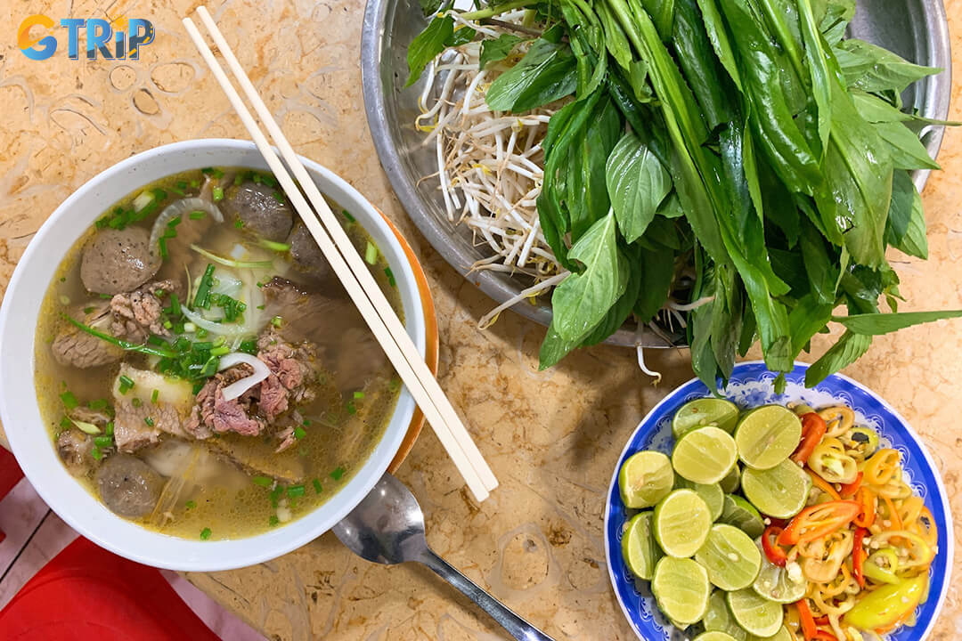 Pho Le serves classic Southern-style pho with rich, slightly sweet broth, a variety of beef cuts, and a generous plate of fresh herbs for customization
