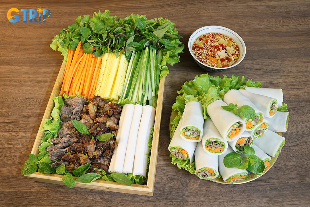 Pho rolls (pho cuon) originated in this neighborhood, featuring fresh rice paper wrapped around stir-fried beef and herbs