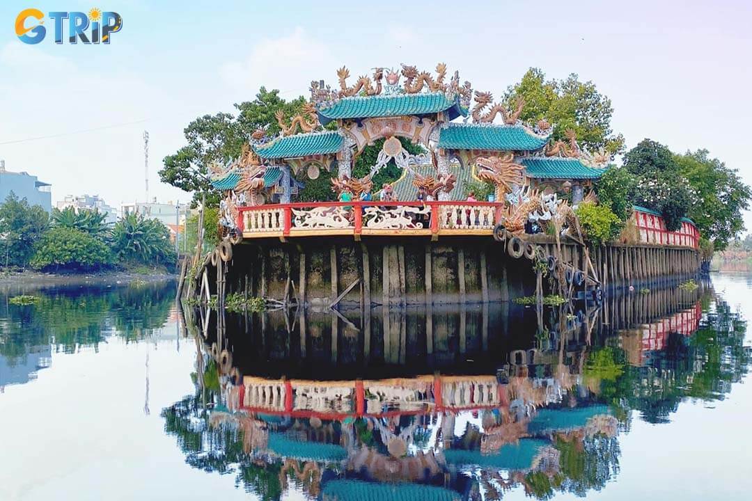 Phu Chau Floating Temple sits on a small islet in the Vam Thuat River, offering a peaceful spiritual retreat with vibrant traditional architecture amid