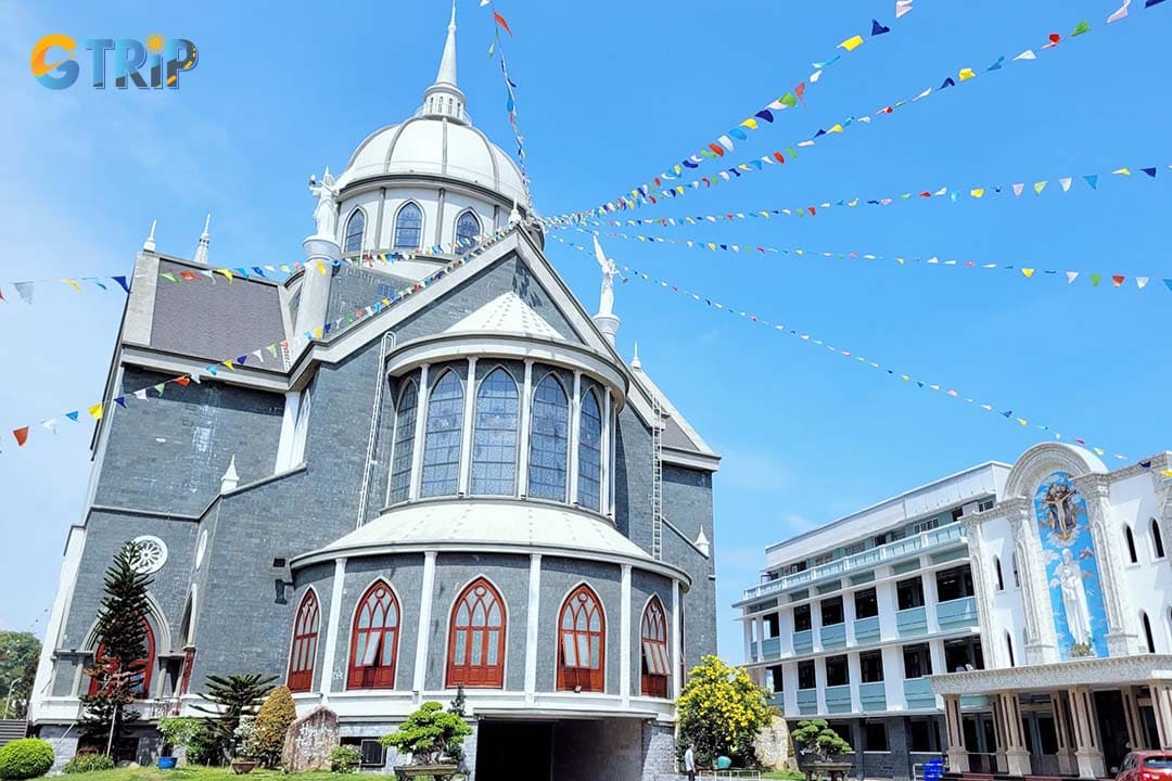 Phu Cuong Cathedral stands out with its striking ark-like modern design, flooded with natural light