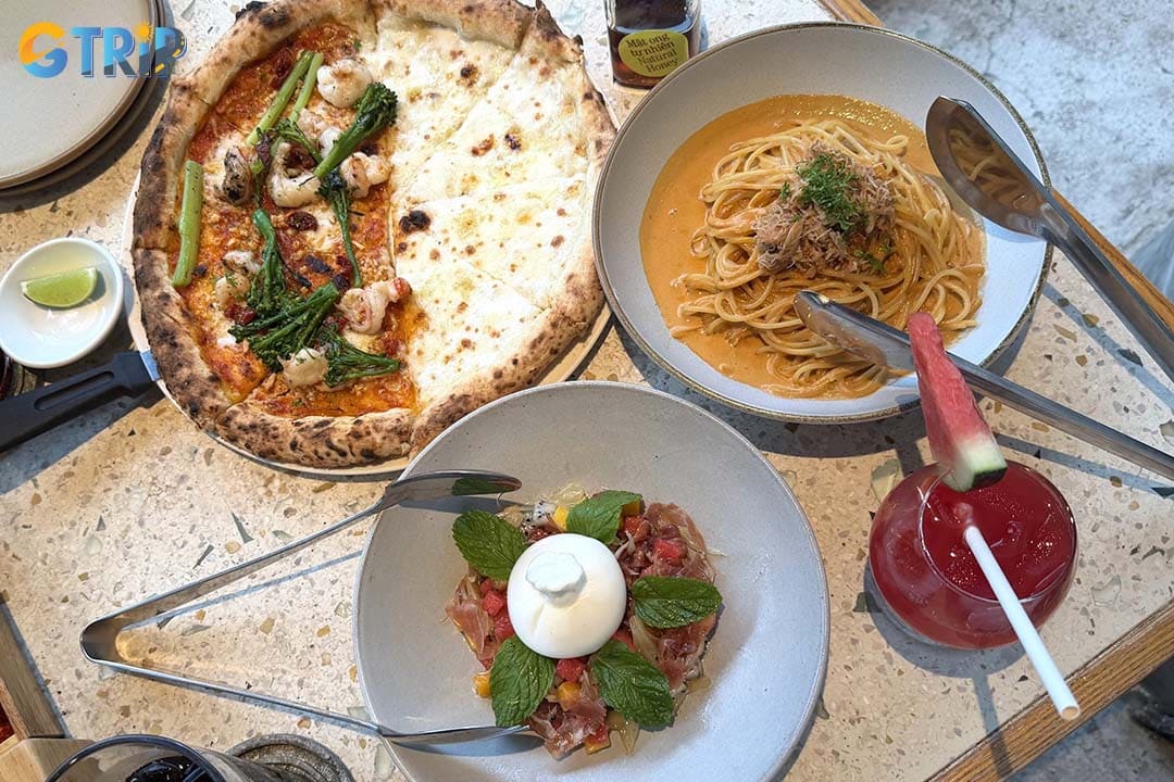 Pizza 4P's is a famous Japanese-Italian fusion restaurant celebrated for house-made cheese, creative pizzas, and stylish interiors