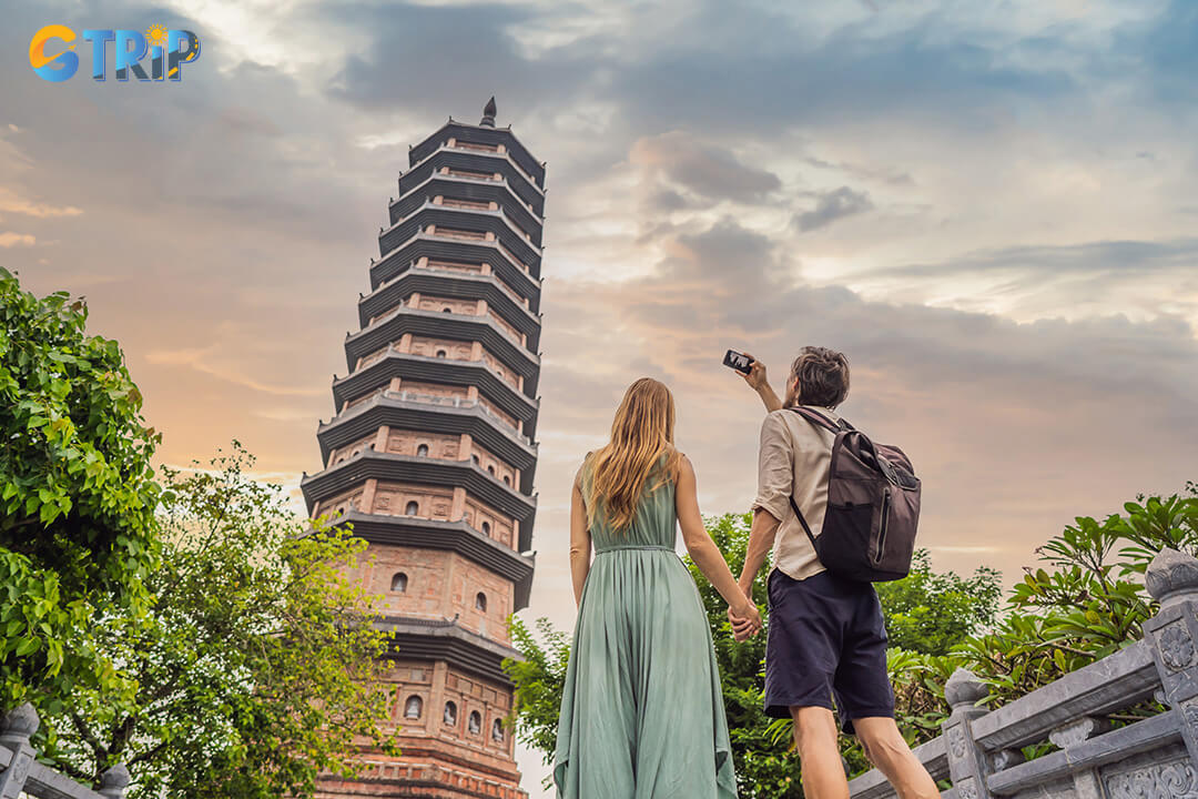 The couple take a nice photos at stupa in Bai Dinh Pagoda