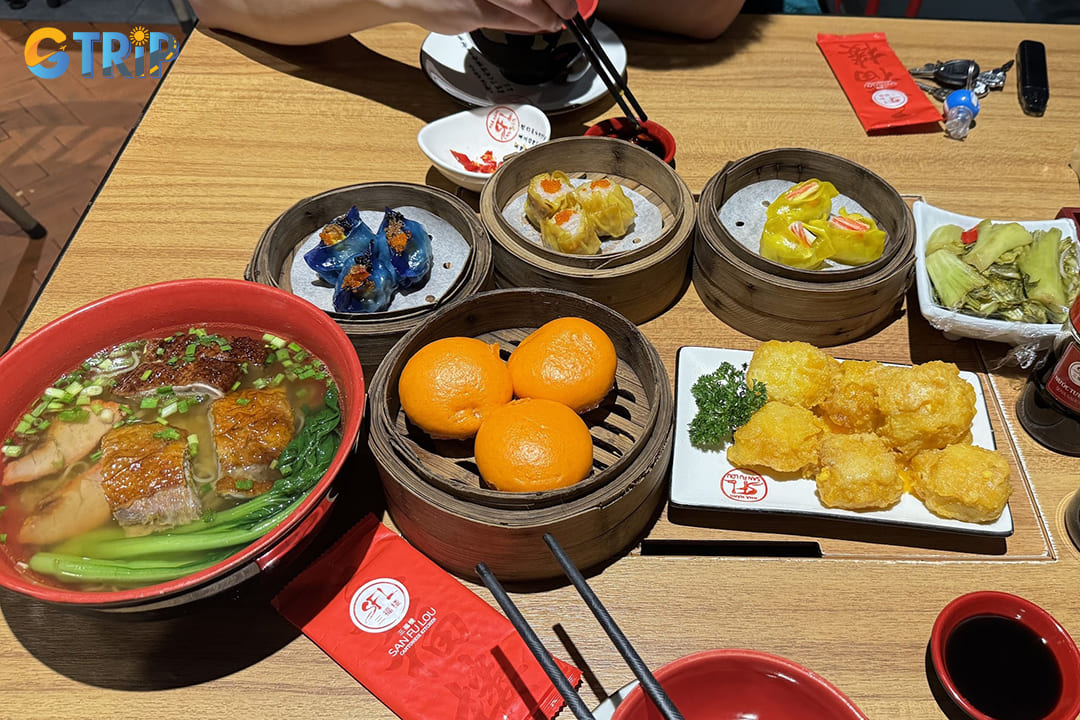 San Fu Lou's menu highlights include meticulously crafted barbecued pork buns, crystal shrimp dumplings, and their signature roasted Peking duck