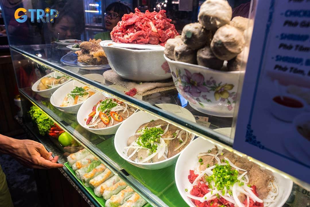 Savor the flavors of Vietnam with a variety of iconic dishes and street food treats at Ben Thanh Market