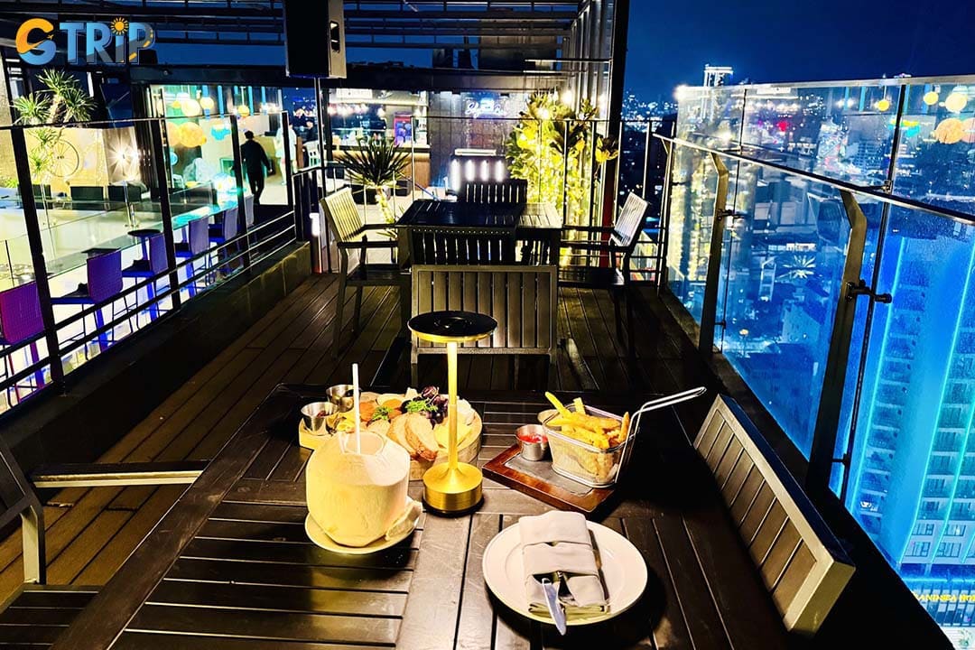 Sky 21 Bar & Bistro is a rooftop bar at Parosand Danang Hotel offering panoramic coastline views and elegant sunset cocktails