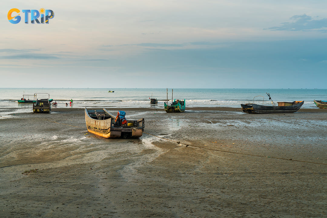 Small fishing boats on the shore of the beach