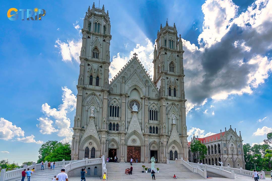 Song Vinh Parish Church is a breathtaking modern Gothic masterpiece, renowned for its massive scale, soaring spires, and cathedral-like interior