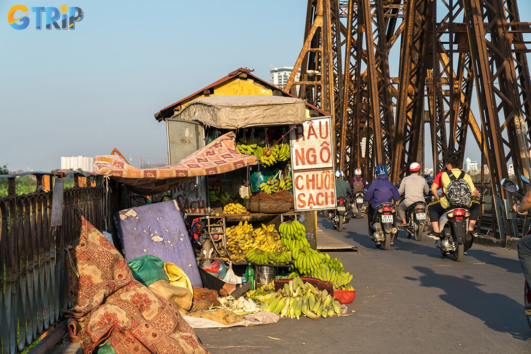 Start your morning at bustling Long Bien Market, then explore Hang Gai Street for handmade silk and traditional Vietnamese craftsmanship