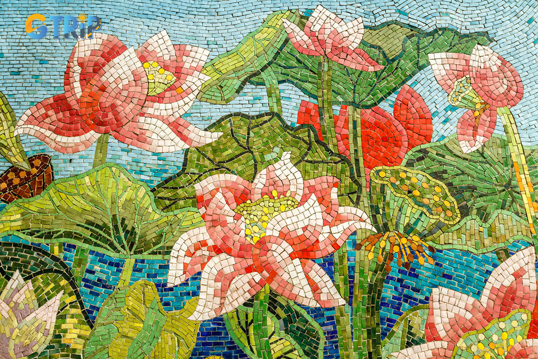 Stay safe at the Hanoi Ceramic Mosaic Mural by watching traffic, staying hydrated, using sun protection, securing valuables, wearing good shoes, and respecting the artwork