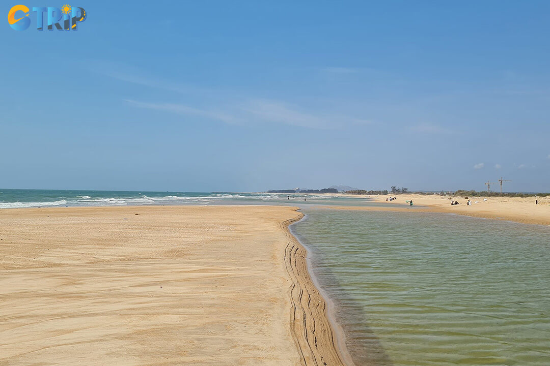 Suoi O Beach is a rare natural retreat where a cool freshwater stream meets the sea, offering a pristine, rustic setting for swimming and nature lovers seeking tranquility