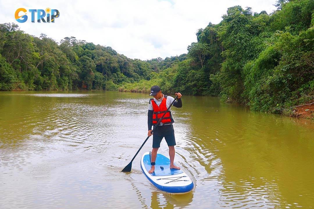 SUP on Thuong Kon Tum Lake lets you explore its calm waters, unique submerged pine trees, and beautiful landscapes