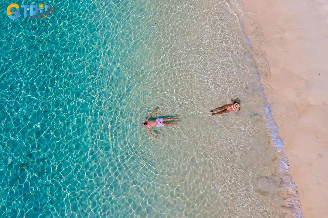 Swimming at Cua Dai Beach is refreshing and safe, with gentle waves and warm, clear conditions ideal during the dry season