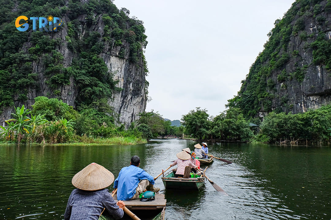 Take a boat ride in the nearby Tam Coc area