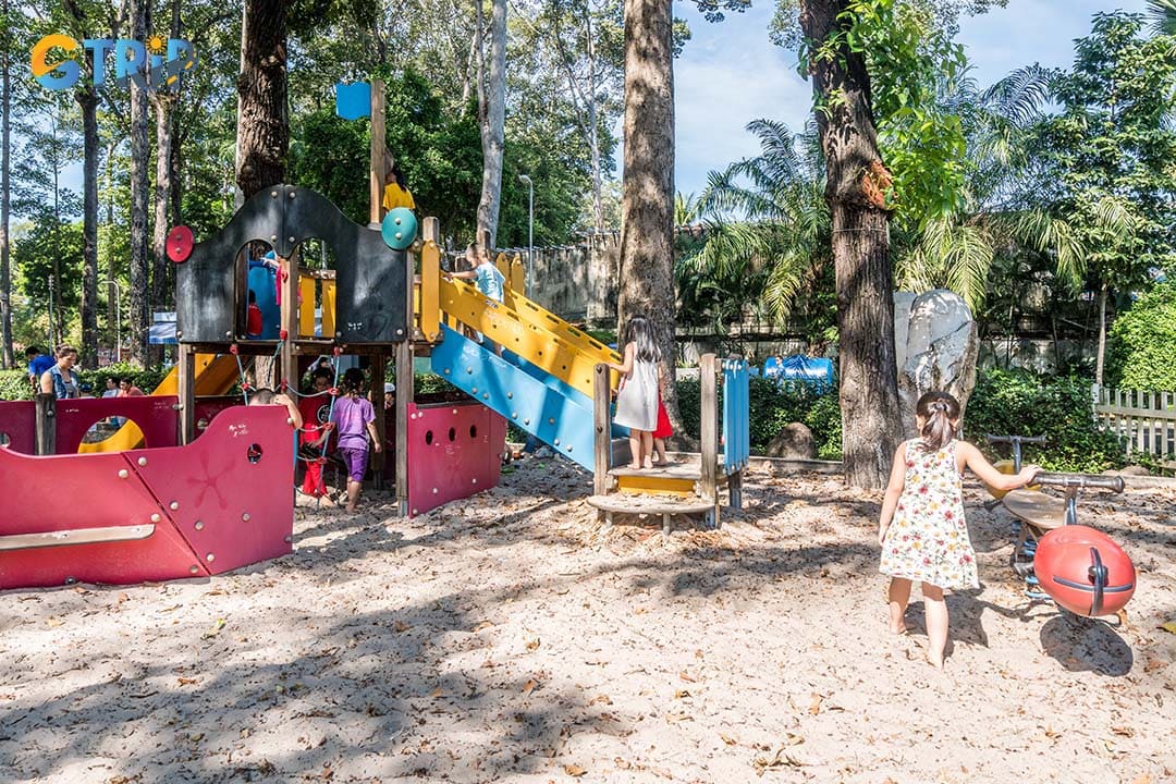 Tao Dan Park features a lively children's playground, offering a safe and spacious area where kids can play freely and make friends