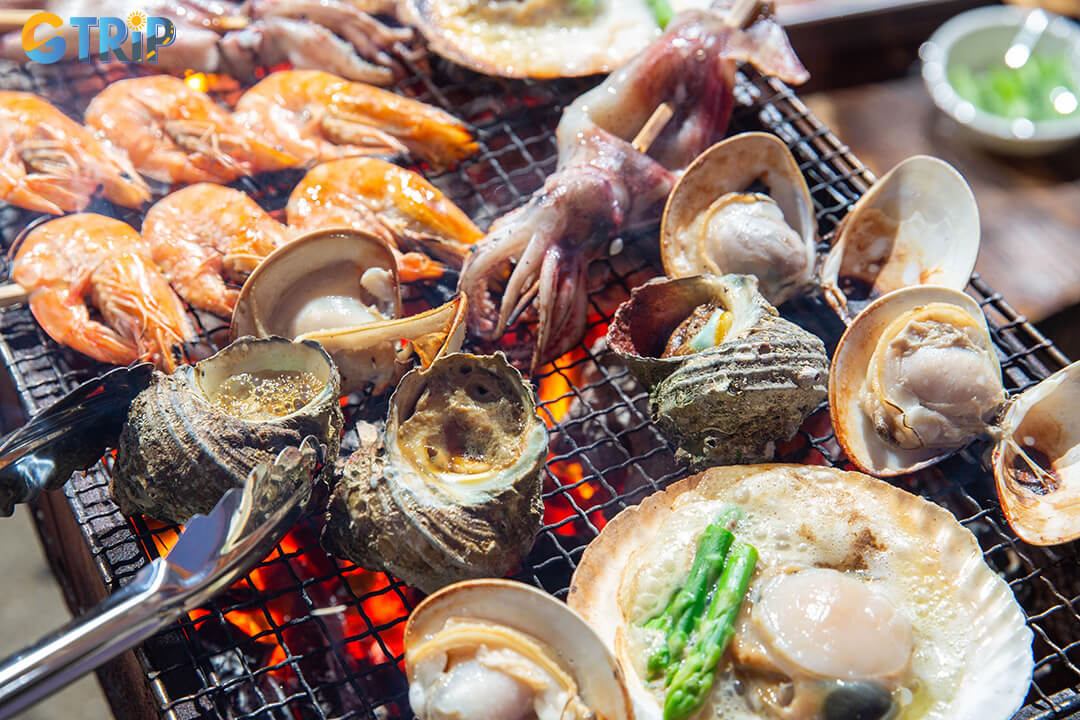 The area around Pham Van Dong Beach is a great place to enjoy fresh Vietnamese seafood, where you can choose live catches and have them cooked to your taste