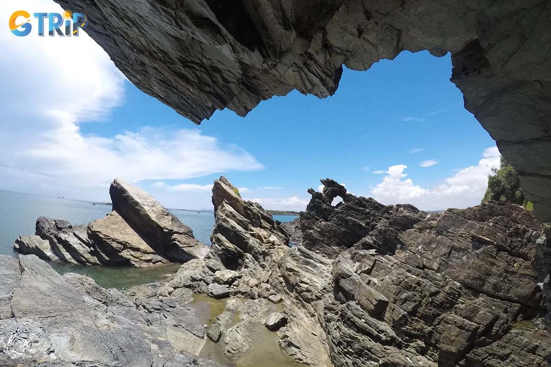 The Ban Than, formed by years of erosion, black volcanic rocks stretch along the coastline, creating natural cliffs and unique shapes