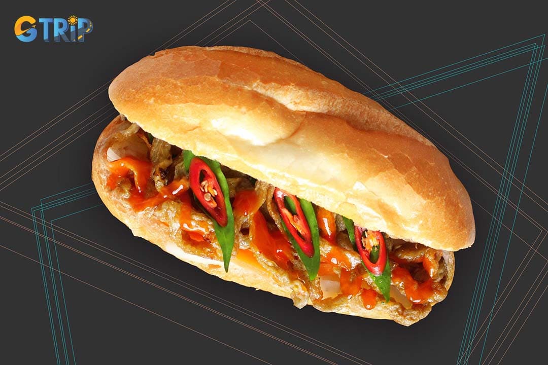 The Banh Mi cha ca features golden, dill-scented fried fish cakes paired with fresh herbs, pickles, and chili sauce