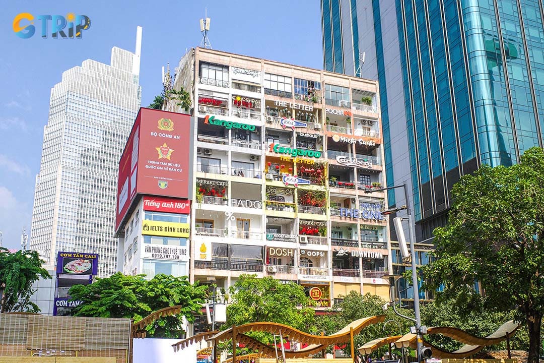 The cafe apartments at 42 Nguyen Hue are a former 1960s residential building transformed into a vibrant vertical hub of cafes, boutiques, and studios