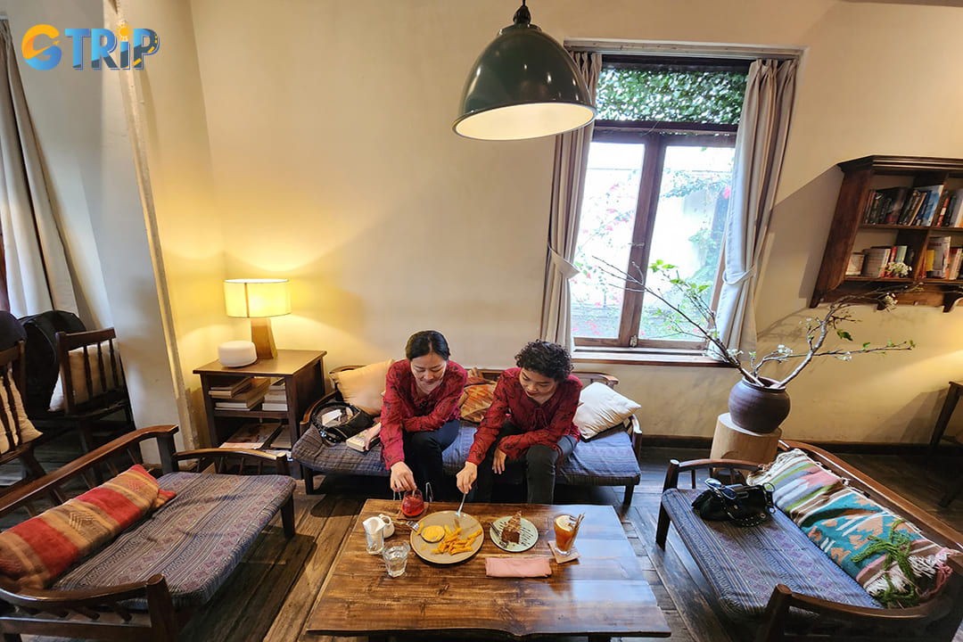 The coffee shop is housed in a beautiful French-style villa with leafy courtyards and warm indoor spaces